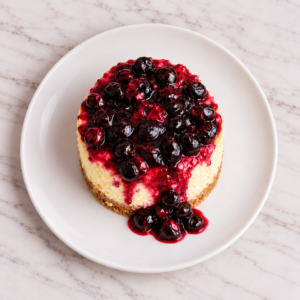 Alternative view of Porción Cheesecake Circular con salsa de Agraz